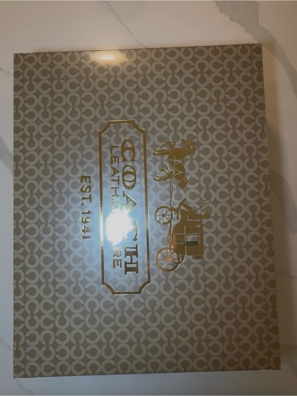 Coach Signature Box with Gold Logo on Beige Pattern